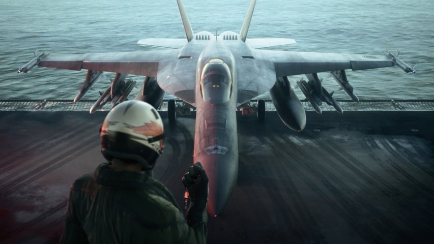 An airman approaches a fighter jet.