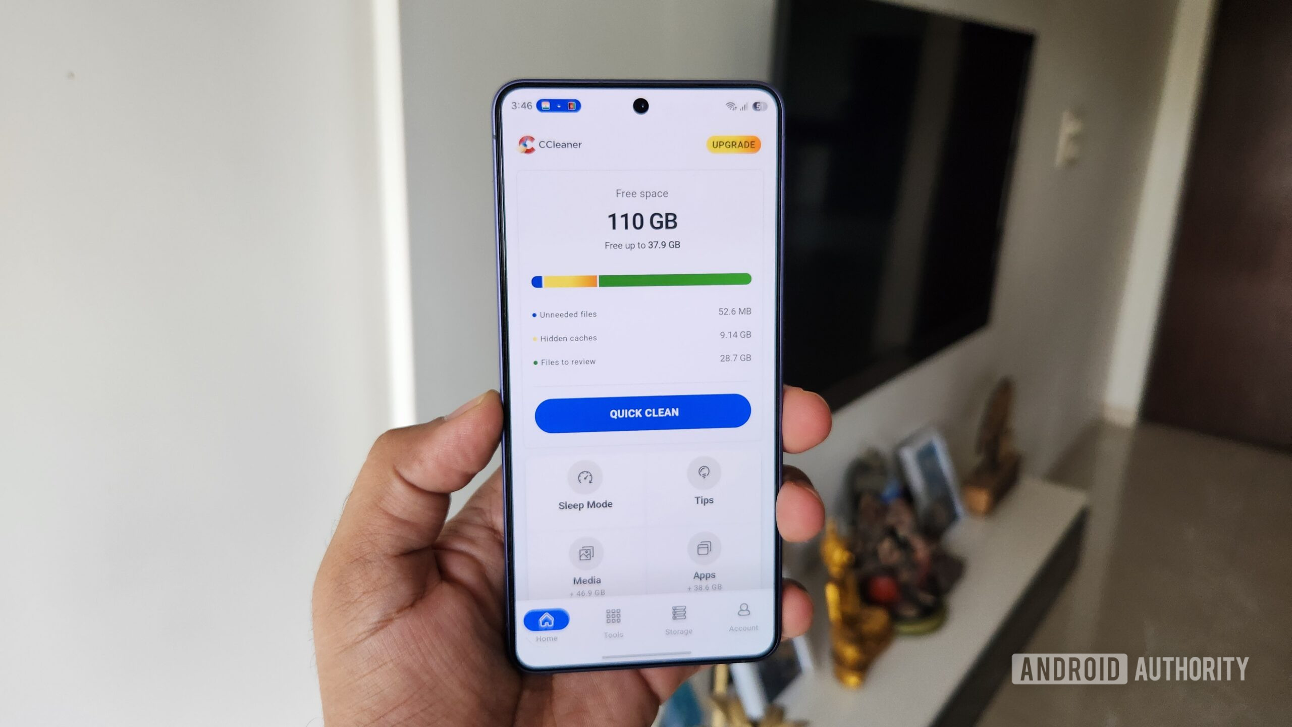 Android phone in hand showing CCleaner app