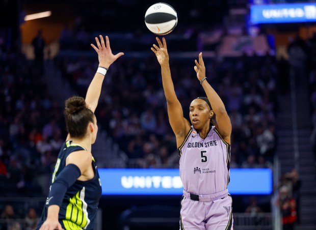 Golden State Valkyries' Kayla Thornton (5) scores a 3-point basket against Dallas Wings' Alysha Clark (32) in the second quarter at the Chase Center in San Francisco, Calif., on Wednesday, June 17, 2026. (Nhat V. Meyer/Bay Area News Group)