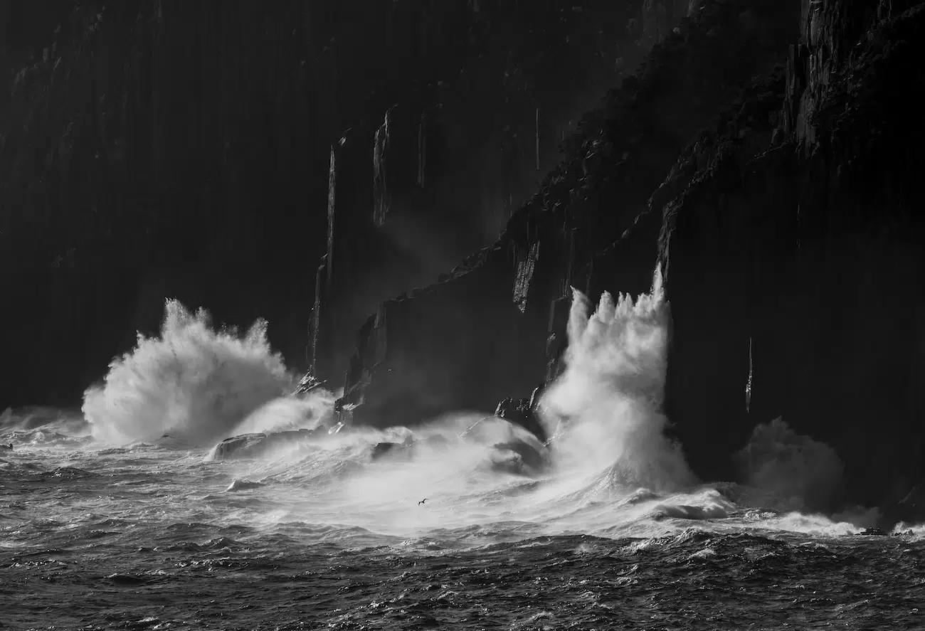 Ocean swell on cliffs below Cape Pillar on Tasmania’s southeast coast