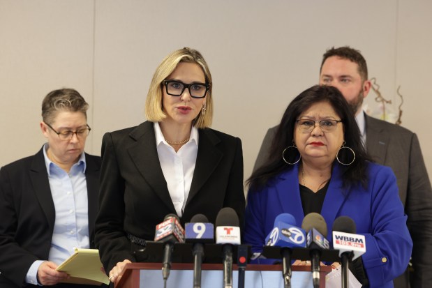 Attorney Tamara Holder talks about her client, Ericka Matos, right, during a press conference at Romanucci & Blandin Law office on April 3, 2024, in Chicago. Matos filed suit against Dr. Fabio Ortega contending he sexually assaulted her decades ago. (Stacey Wescott/Chicago Tribune)