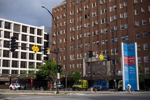 A bicyclist rides past Mount Sinai Hospital, June 16, 2026, in Chicago. (Josh Boland/Chicago Tribune)