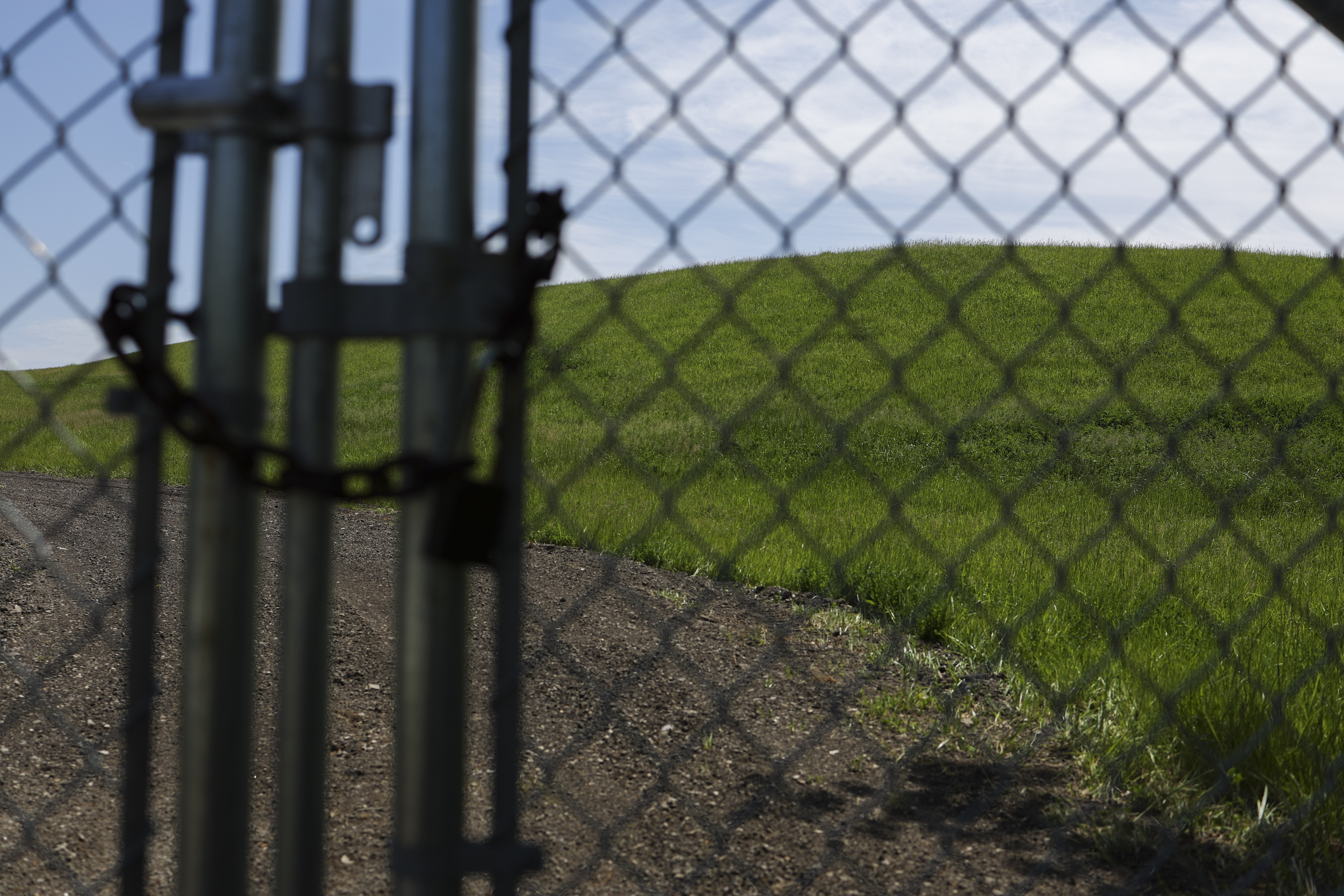 A gate stands in front of Yard 520 landfill, which...