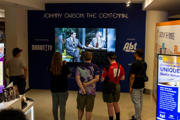 Museum visitors watch a video montage that's part of the "Johnny Carson: The Centennial exhibition" on display at the Museum of Broadcast Communications in the West Loop on June 4, 2026. (Eileen T. Meslar/Chicago Tribune)