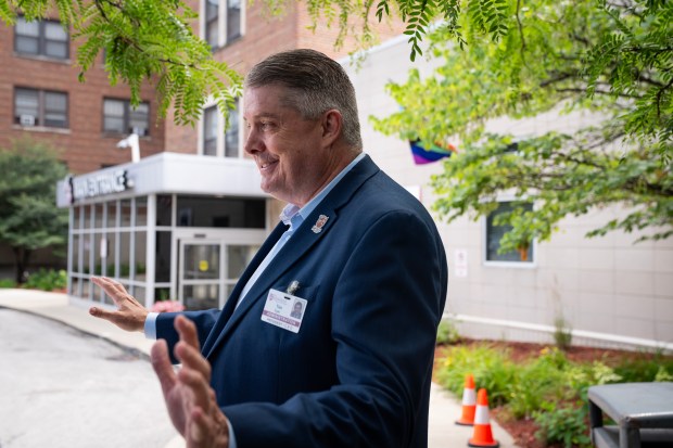 Roseland Community Hospital President and CEO Tim Egan speaks to the media as U.S. Sen. Dick Durbin visits the hospital to highlight the threats to safety net hospitals in Illinois, July 11, 2025. (E. Jason Wambsgans/Chicago Tribune)