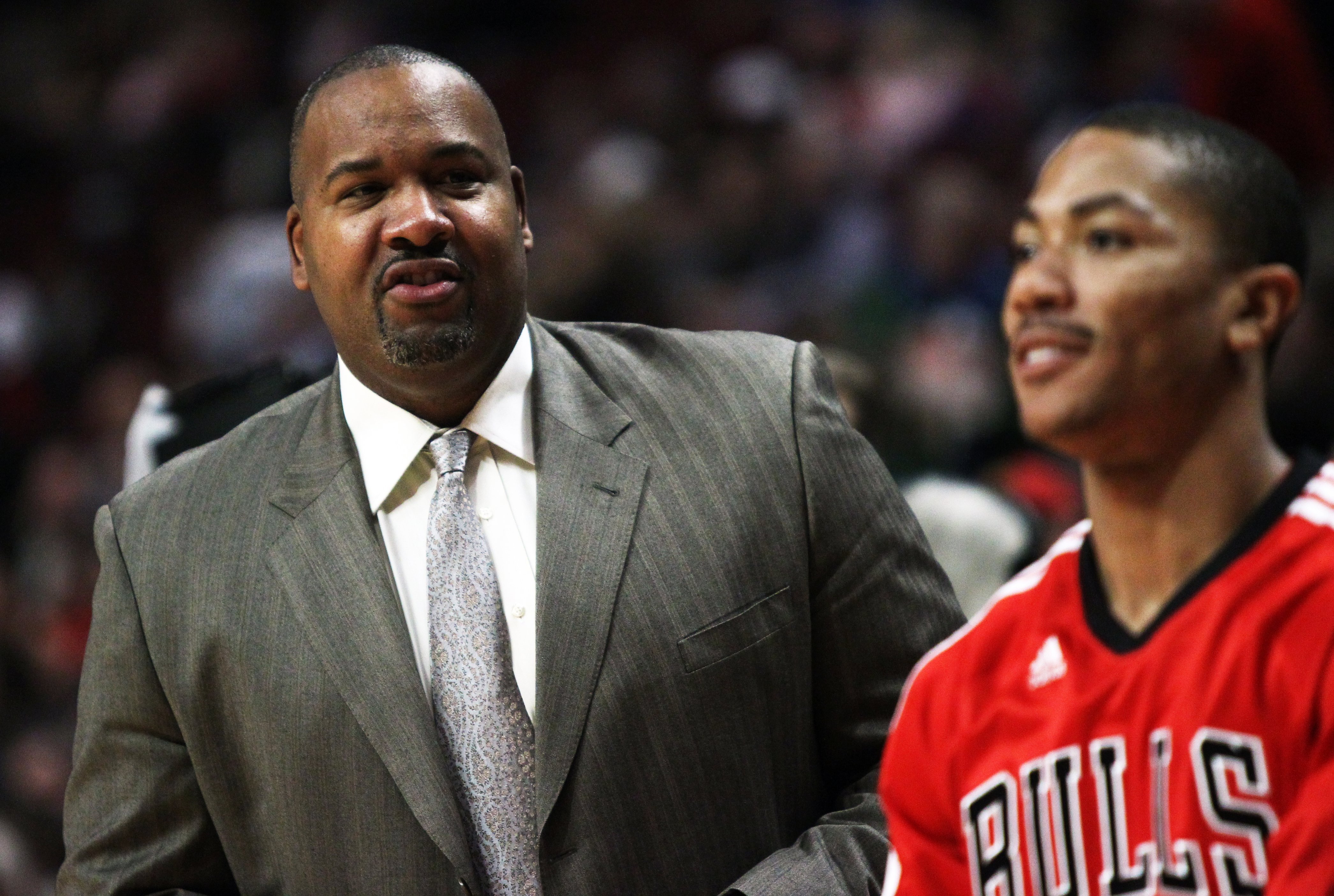 Bulls announcer Stacey King looks toward Derrick Rose during warmups...