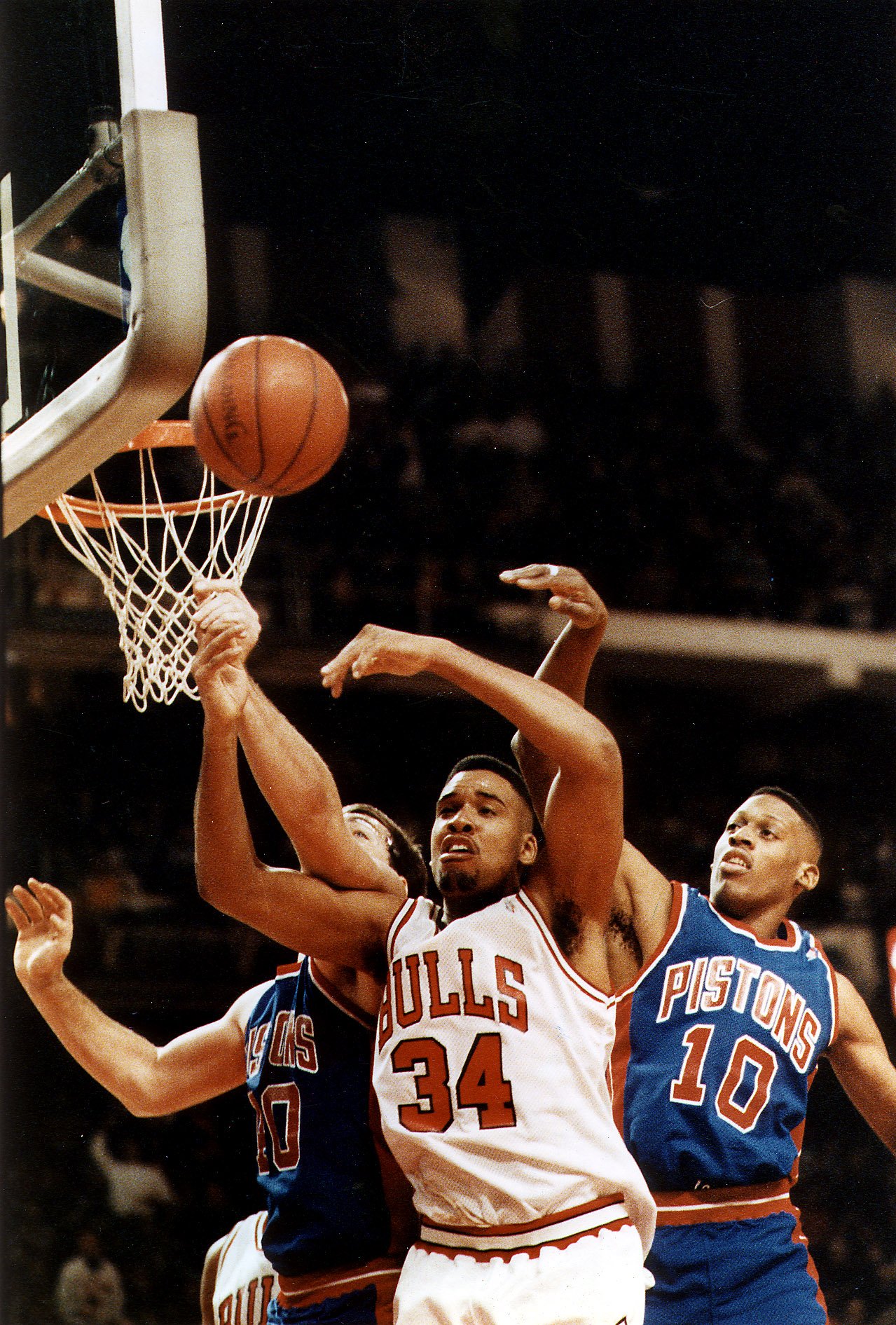 The Bulls' Stacey King gets bumped by Dennis Rodman (10)...