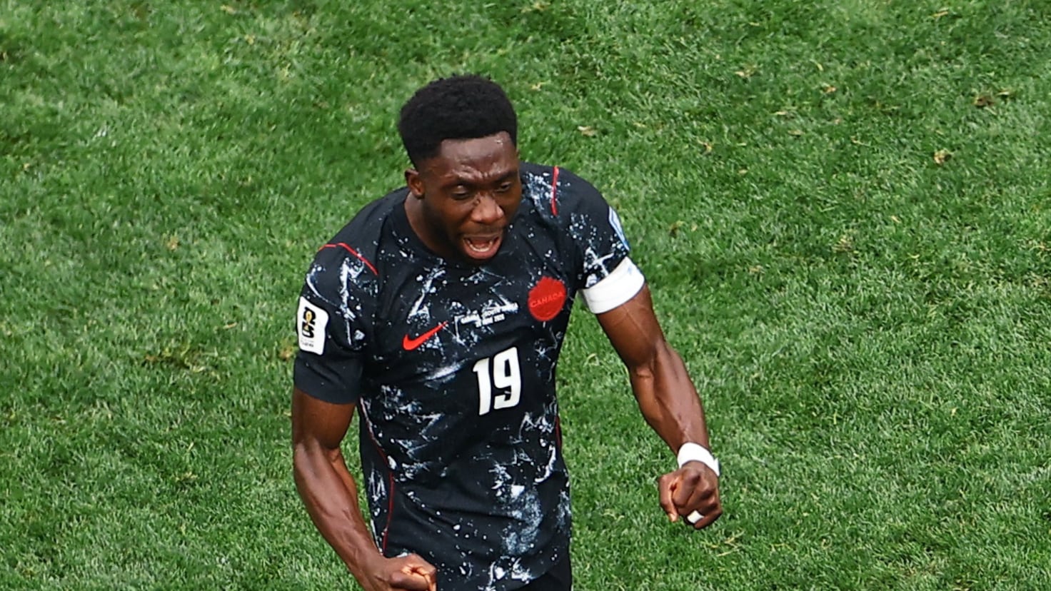 Why is Alphonso Davies not playing today for Canada against South Africa in the World Cup?