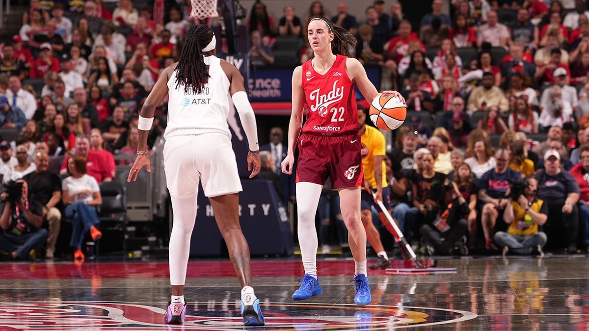 Caitlin Clark dribbling during a WNBA game