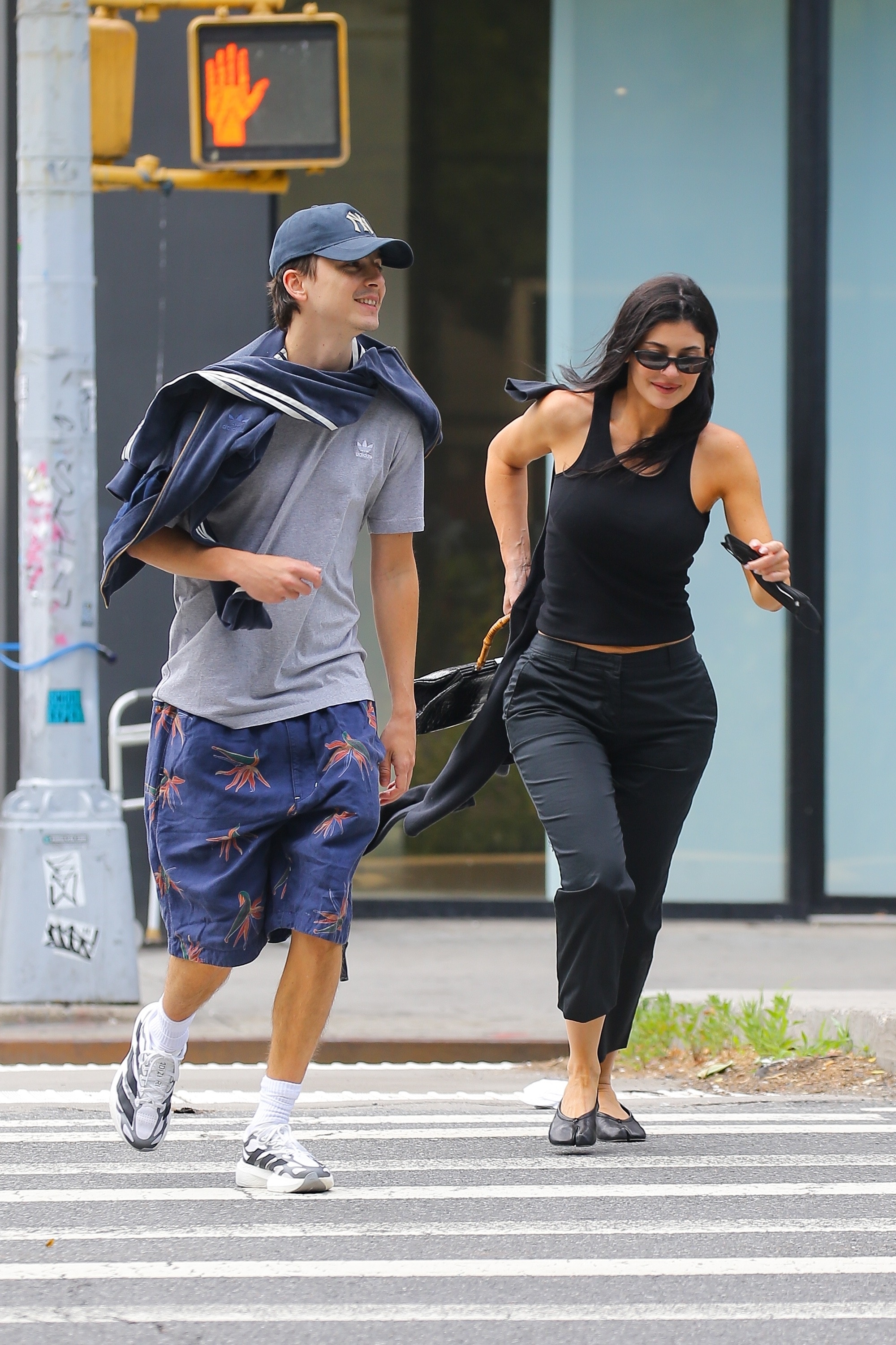 Kylie Jenner wears Maison Margiela Tabi Ballerina Flats on a Citi Bike with Timothee Chalamet