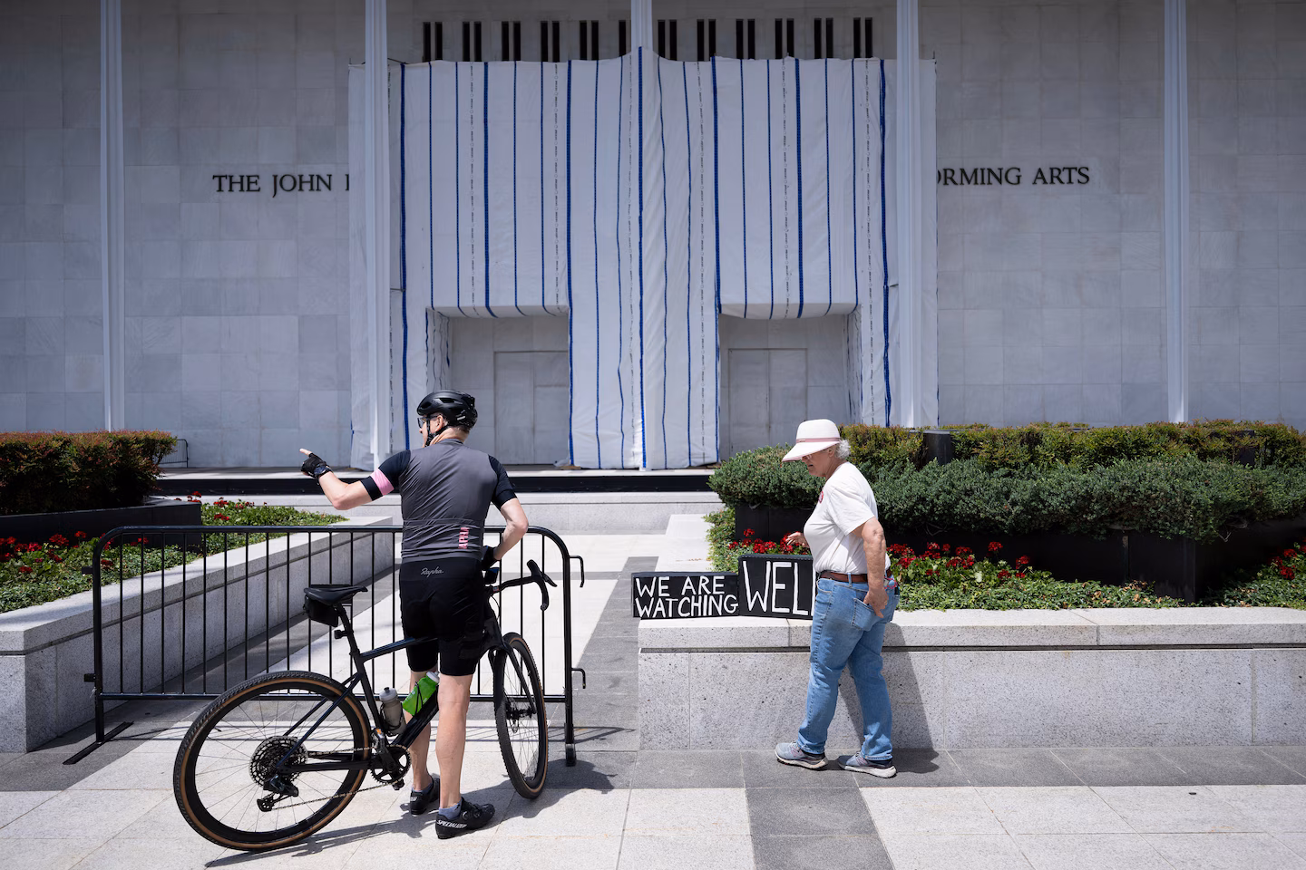 Trump’s name is off the Kennedy Center. A tarp is still hiding the proof.