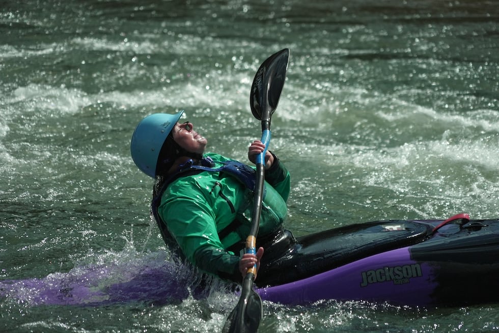 Hannah Ray J Childs kayaks at a whitewater park she helped create on the Maquoketa River...