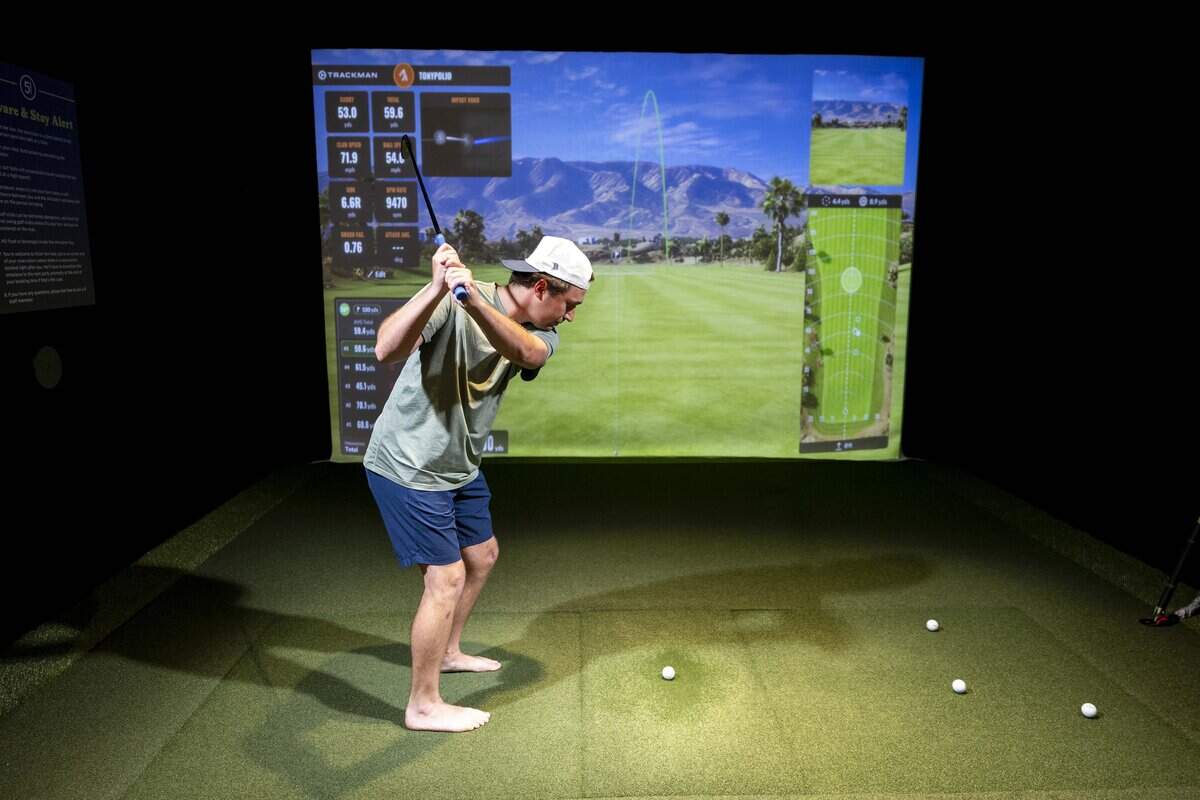 Tony Polio practices his golf swing at Five Iron Golf during its grand opening celebration on Thursday, June 11, 2026 in Fort Worth.