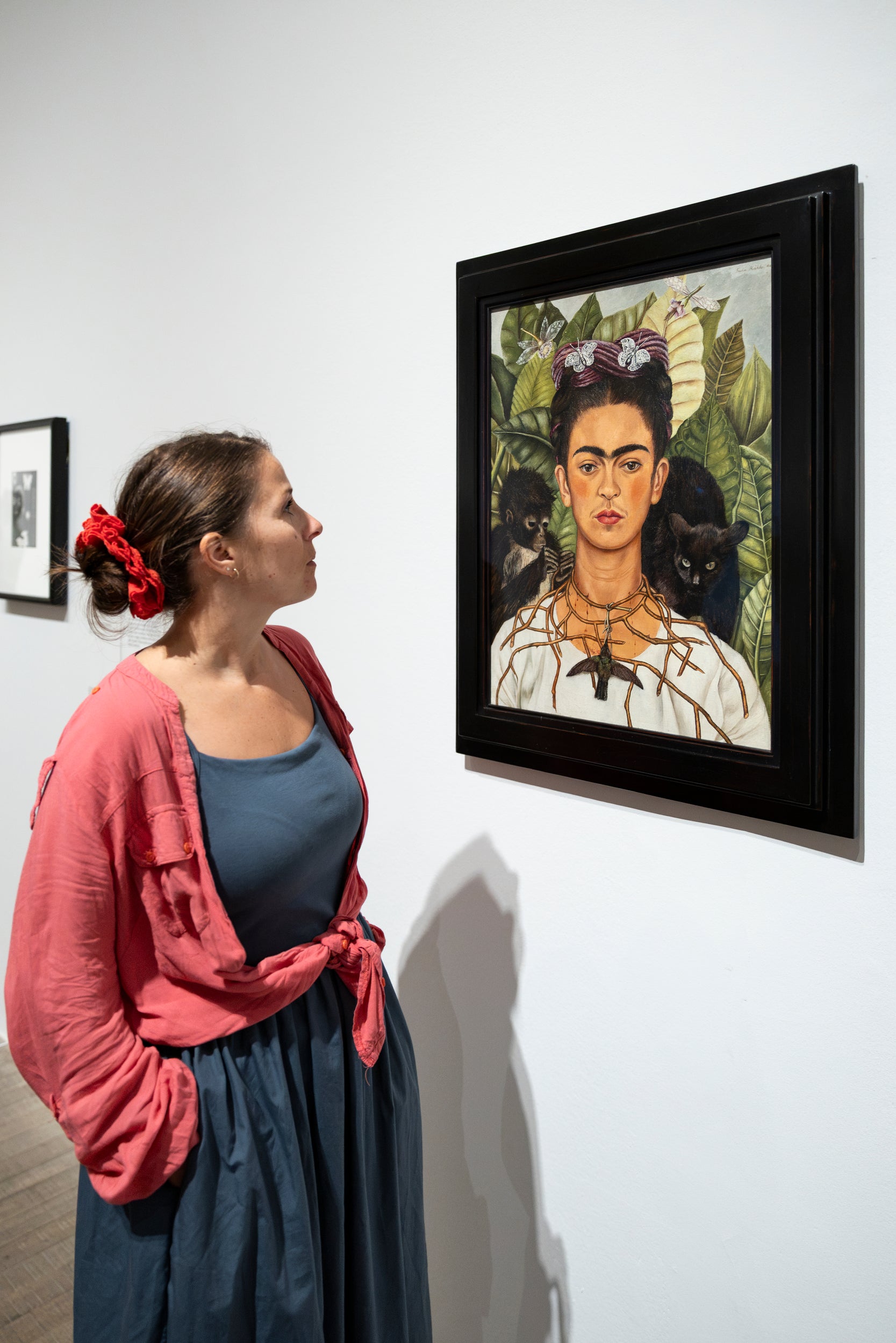 A visitor studies one of Kahlo’s self-portraits at Tate Modern’s ‘Frida: The Making of an Icon’