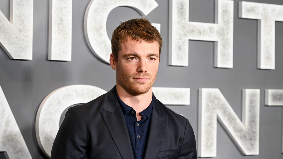 Gabriel Basso standing at the L.A. Special Screening of The Night Agent