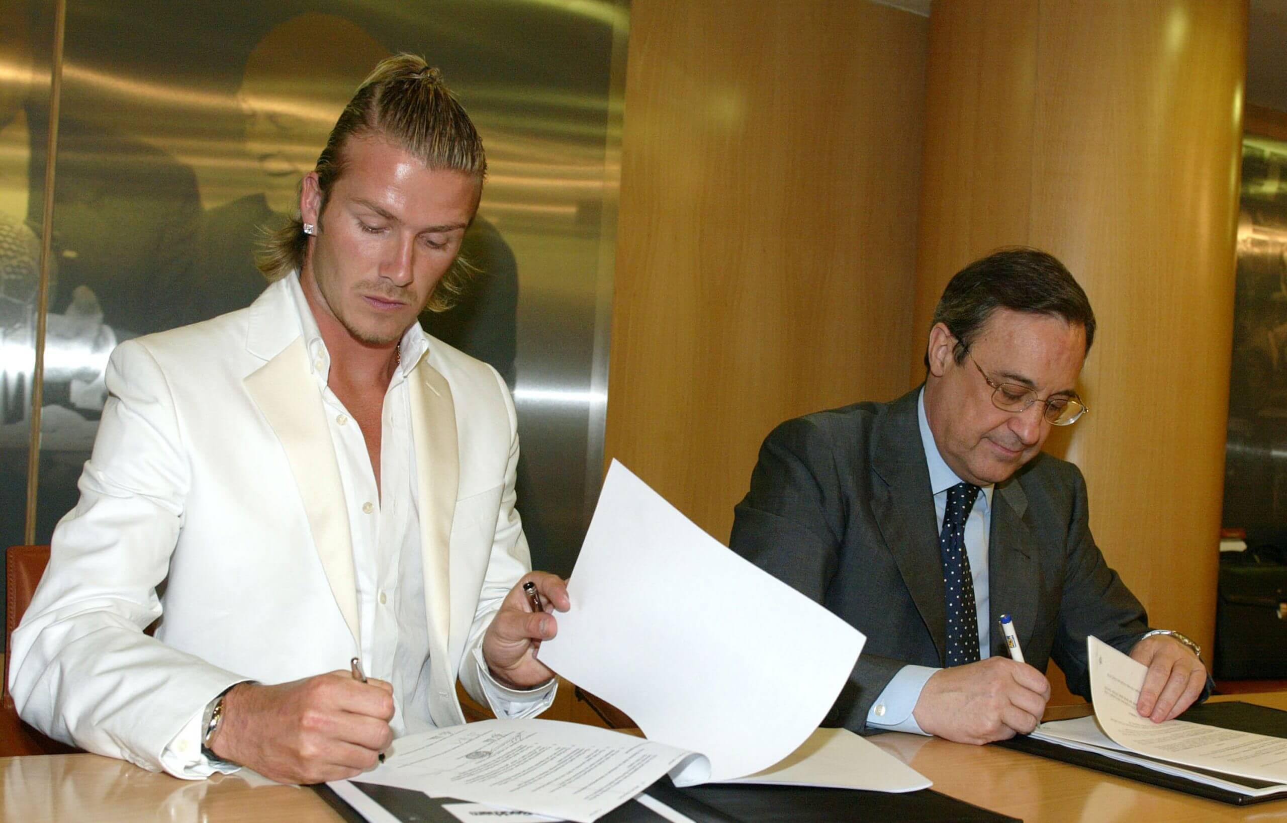 Beckham pictured at his Real Madrid unveiling alongside Perez in July 2003