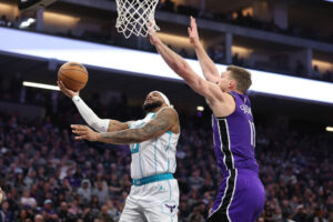 SACRAMENTO, CALIFORNIA - FEBRUARY 24: Miles Bridges #0 of the Charlotte Hornets goes up for a shot against Domantas Sabonis #11 of the Sacramento Kings during the first half at Golden 1 Center on February 24, 2025 in Sacramento, California. NOTE TO USER: User expressly acknowledges and agrees that, by downloading and/or using this photograph, user is consenting to the terms and conditions of the Getty Images License Agreement. (Photo by Ezra Shaw/Getty Images)
