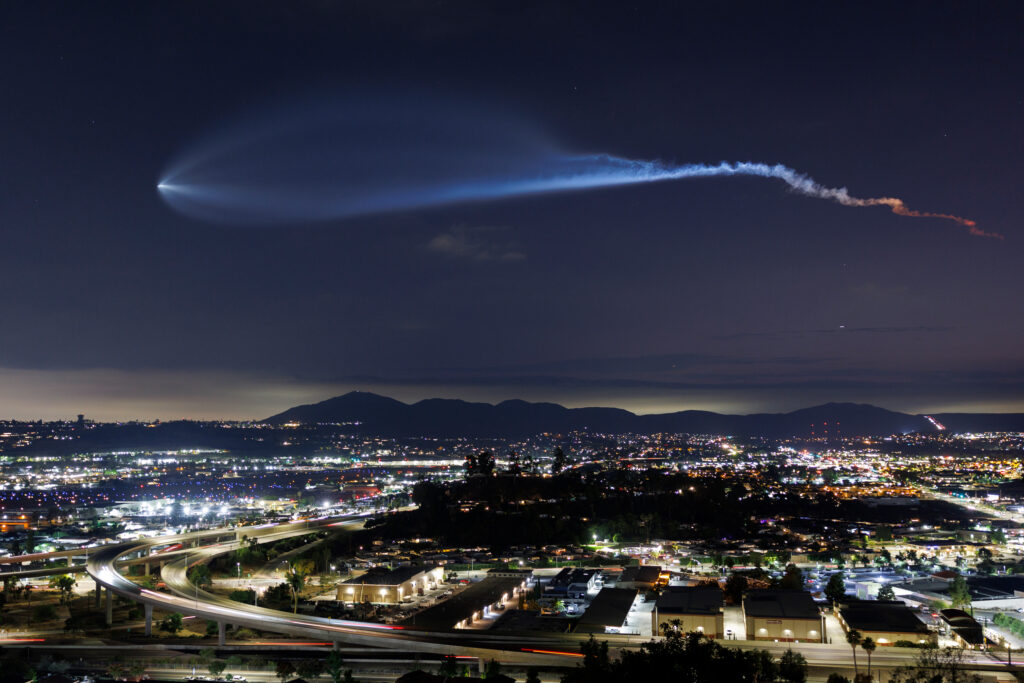A SpaceX Falcon 9 rocket carrying a payload of 24 Starlink satellites soars over Santee, Calif., after launching from Vandenberg Space Force Base on July 18, 2025. Credit: Kevin Carter/Getty Images