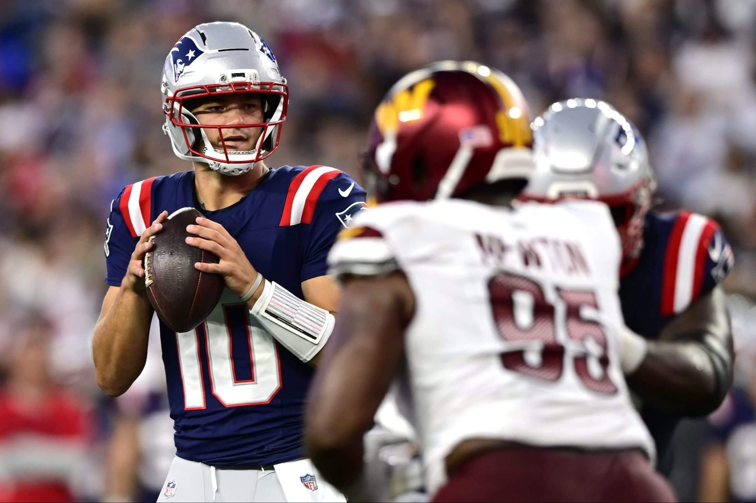 Patriots quarterback Drake Maye drops back to pass against the Commanders.