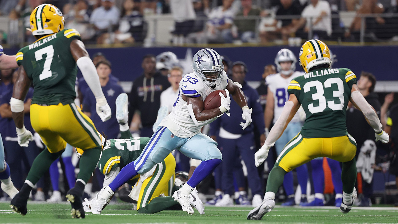 Javonte Williams #33 of the Dallas Cowboys carries the ball against the Green Bay Packers in the game at AT&T Stadium on September 28, 2025 in Arlington, Texas.