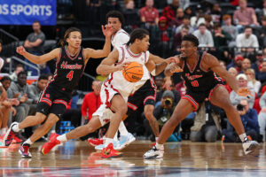 NEWARK, NEW JERSEY - DECEMBER 20: Darius Acuff Jr. #5 of the Arkansas Razorbacks dribbles the ball as Kingston Flemings #4 of the Houston Cougars defends during the first half of the Never Forget Tribute Classic at Prudential Center on December 20, 2025 in Newark, New Jersey. (Photo by Ed Mulholland/Getty Images) Sacramento Kings
