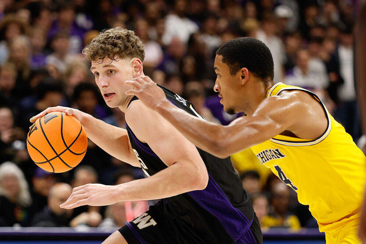 Hannes Steinbach #6 of the Washington Huskies controls the ball against Nimari Burnett #4 of the Michigan Wolverines during the second half of the game at the Alaska Airlines Arena on January 14, 2026 in Seattle, Washington.