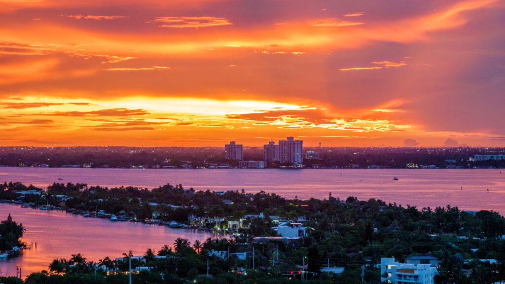 An aerial view over Miami’s Biscayne Bay at sunset. Credit: Jeffrey Greenberg/Universal Images Group via Getty Images