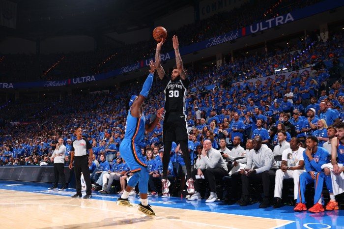 Julian Champagnie shoots a 3-pointer.