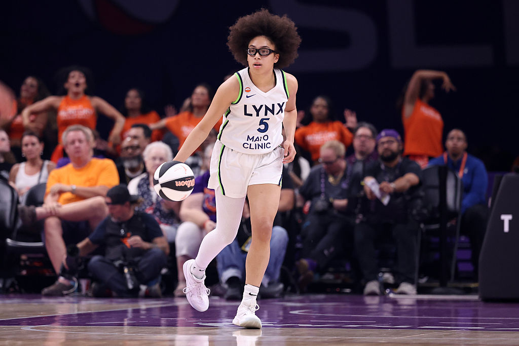 PHOENIX, ARIZONA - JUNE 01: Olivia Miles #5 of the Minnesota Lynx dribbles the ball during the first half of a WNBA Commissioner Cup Game against the Phoenix Mercury at Mortgage Matchup Center on June 01, 2026 in Phoenix, Arizona. The Lynx defeated the Mercury 111-77.