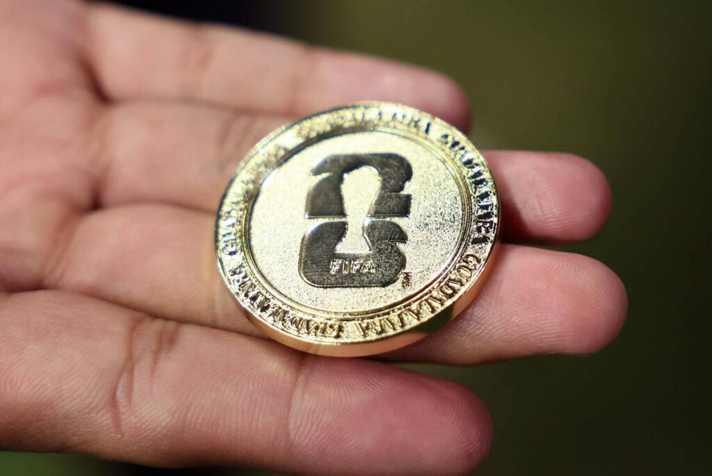 A detailed view of the coin used in the toss before penalties at the World Cup