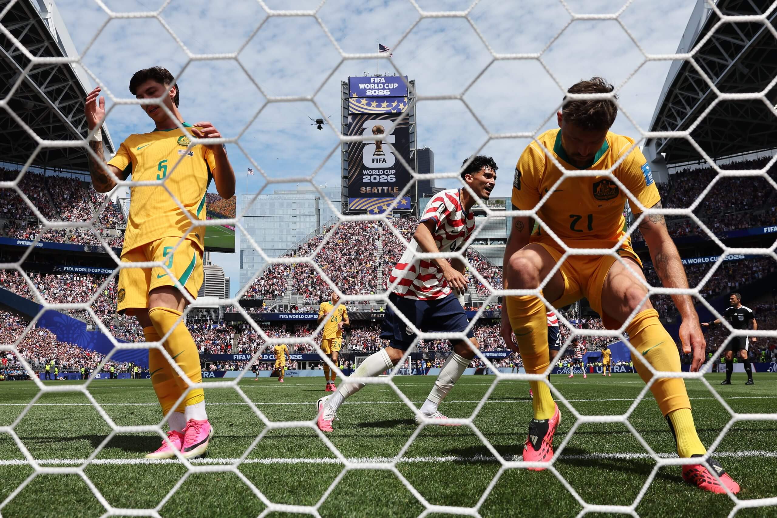 Australia players react to an own goal against the USMNT