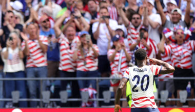 SEATTLE, WASHINGTON - JUNE 19: Folarin Balogun #20 of the United States celebrates the team's first goal scored an own goal by Cameron Burgess #21 (not pictured) of Australia during the FIFA World Cup 2026 Group D match between USA and Australia at Seattle Stadium on June 19, 2026 in Seattle, Washington. (Photo by John Dorton/USSF/Getty Images)