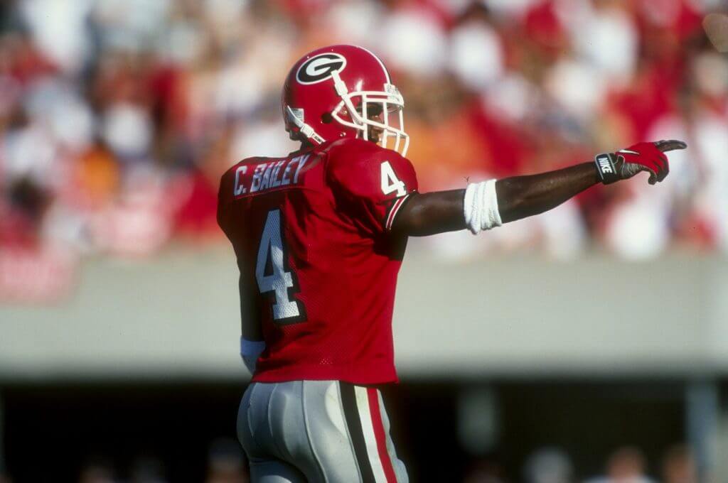 Champ Bailey lines up and raises his right arm in a Georgia football uniform