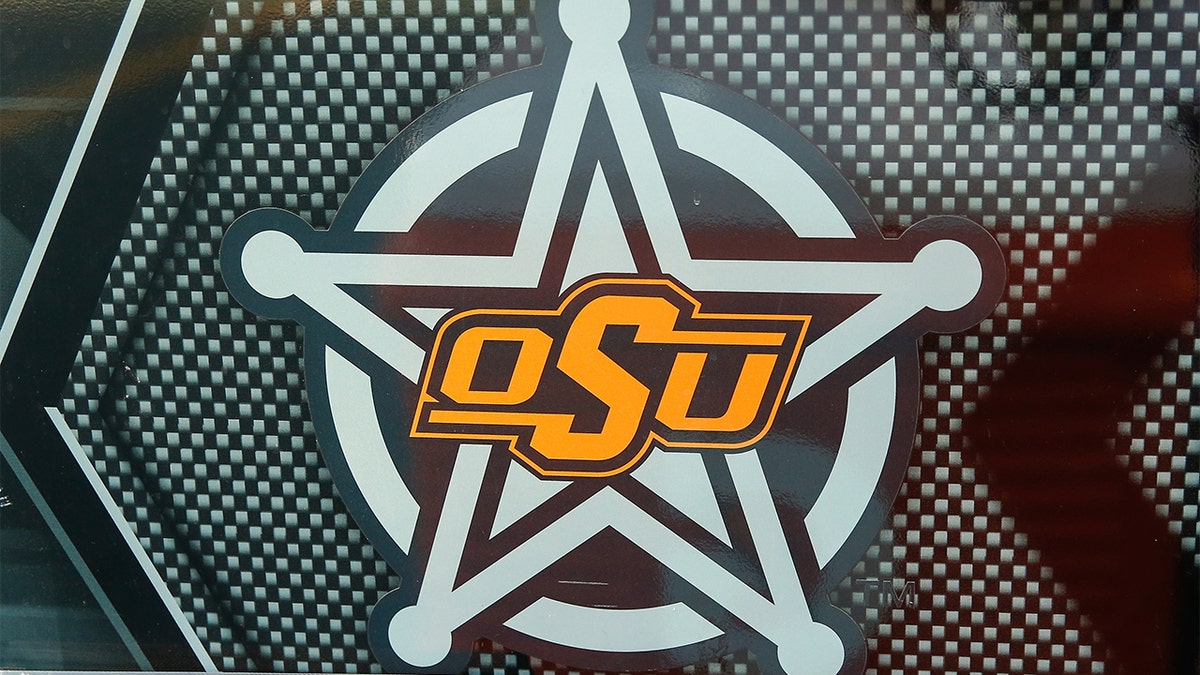 Oklahoma State Cowboys logo on field before college football game in Tempe Arizona