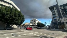 The sky in downtown Los Angeles after a fire broke out at a commercial building in Boyle Heights on Wednesday, June 17, 2026.
