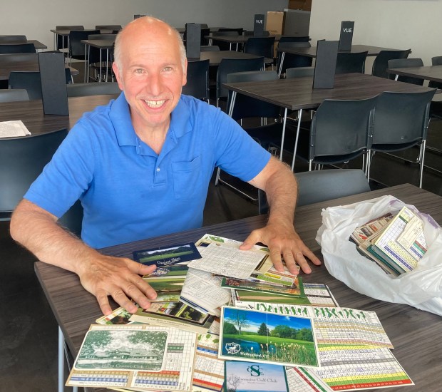 A man and his scorecards. Hamden's Andy Taddei Jr. has been on a 25-year quest to play every public golf course in Connecticut. He played 97, with one to go. (Dom Amore/Hartford Courant)