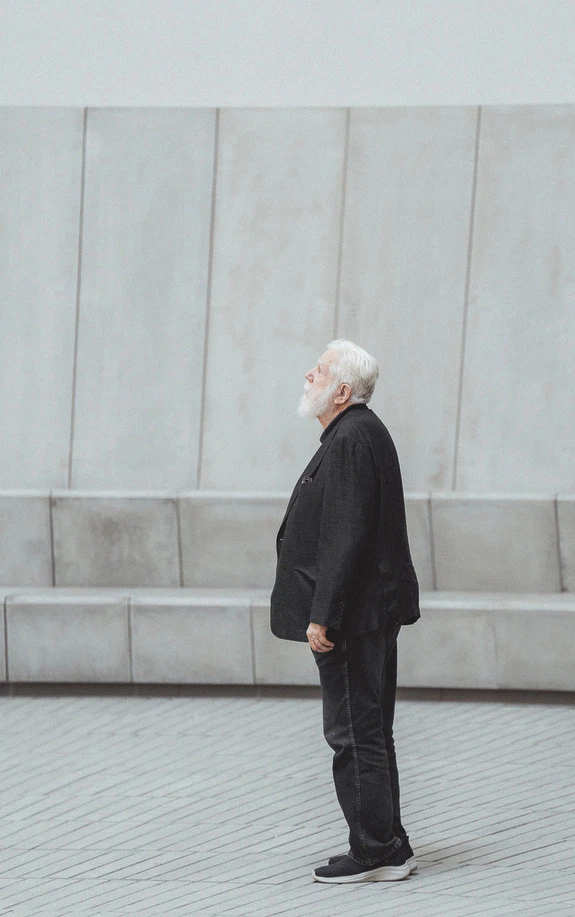 Artist James Turrell stands thoughtfully in one of his Skyscapes.