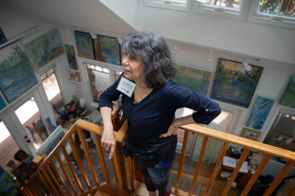 Jane Medved (Painter, Sculptor) observing her work in her studio.