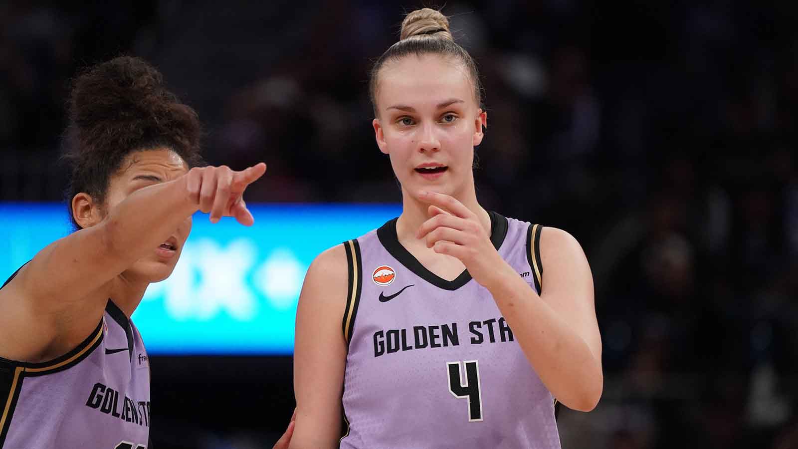 Golden State Valkyries guard Juste Jocyte (4) receives directions from guard Veronica Burton (22) during a game against the Indiana Fever in the fourth quarter at Chase Center.