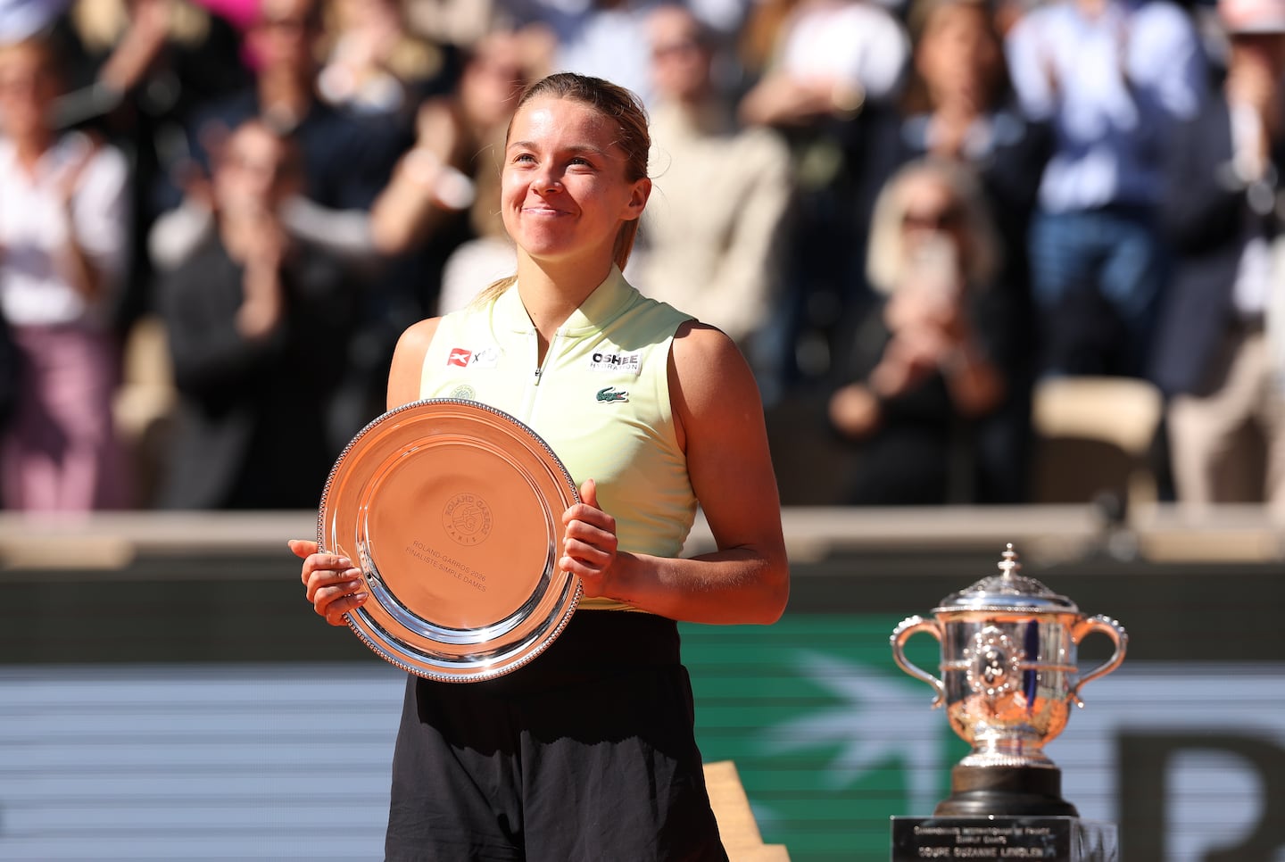 Maja Chwalinska posed with the French Open's runner-up silver platter after coming so close to lifting the winner's trophy as a qualifier.