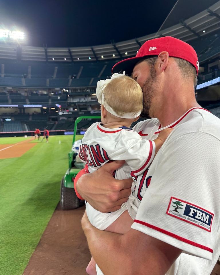 Trey Mancini and his wife, Sadie, pose with their daughter Sadie at Angel Stadium on June 8, when Mancini made his return to Major League Baseball.