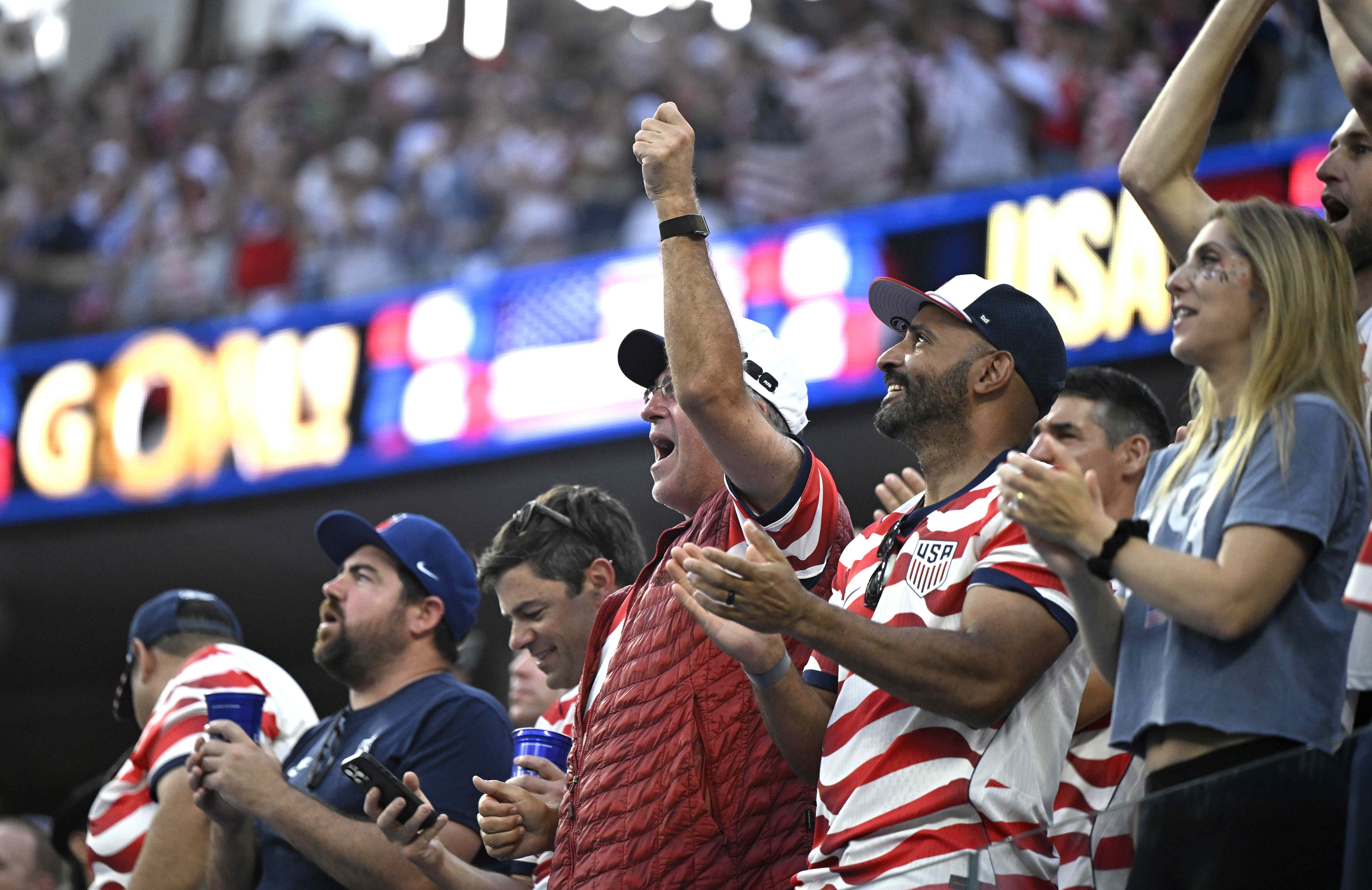 United States fans cheer a the U.S. takes a 2-0...