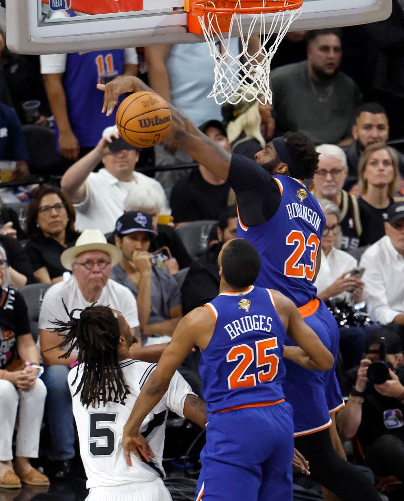 Mitchell Robinson blocks Stephon Castle's shot during the second half of the Knicks' 105-104 win over the Spurs in Game 2 of the NBA Finals on June 5, 2026 in San Antonio. 