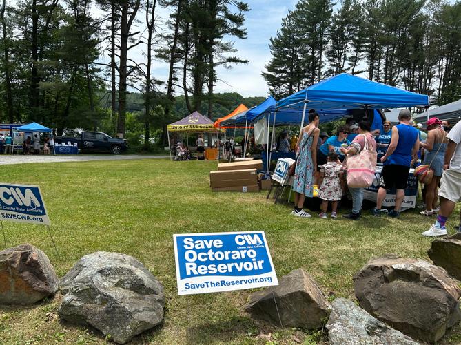 “Save the Octoraro Reservoir” and “Save CWA” signs at the Chester Water Authority’s “Public Water Independence Day” event at Octoraro Reservoir on June 6, 2026.