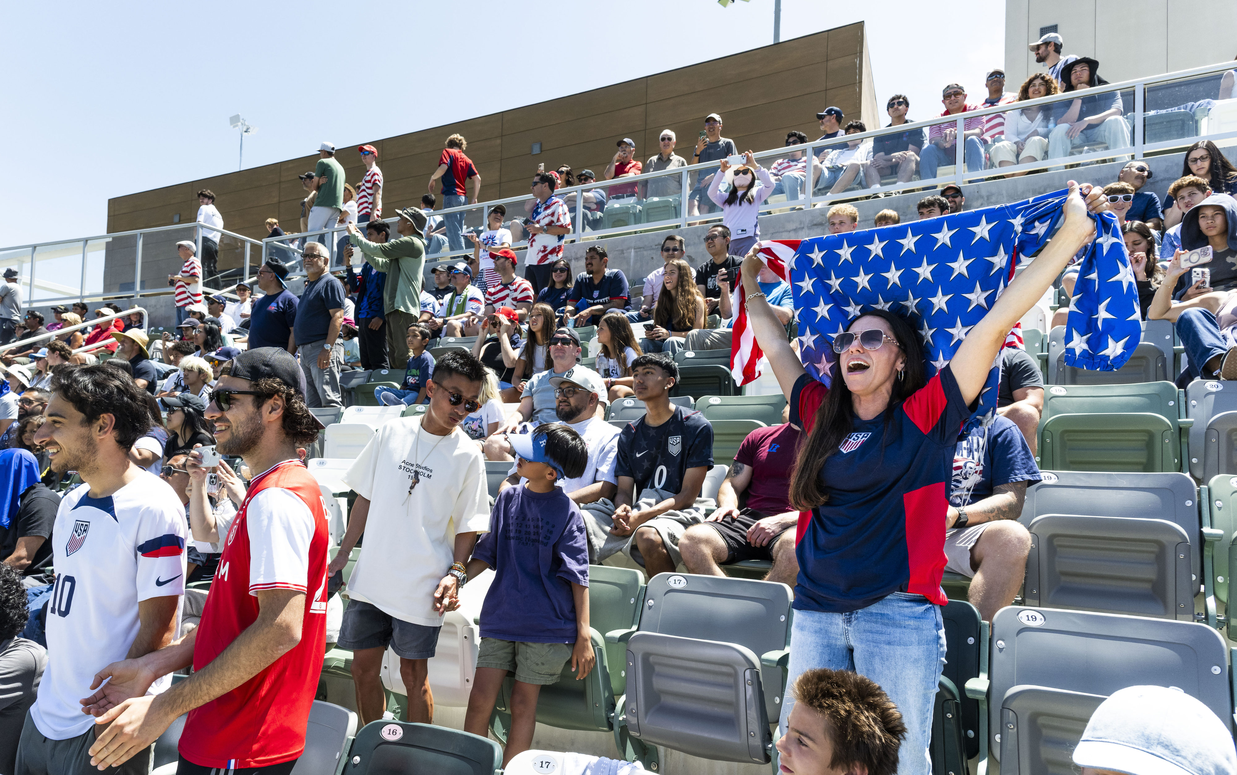 Martha Gray, right, cheers for the U.S. Menâs National Team...