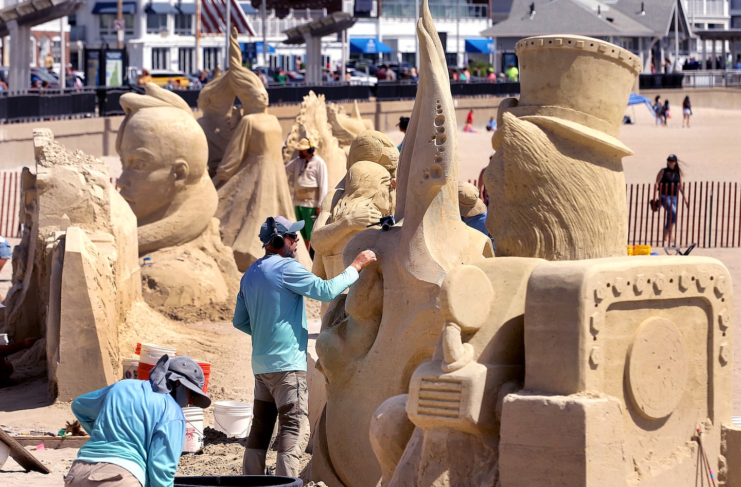 Competitors work on their sand sculptures during the 26th Annual Hampton Beach Master Sand Sculpting Classic on Saturday, June 20, 2026. 