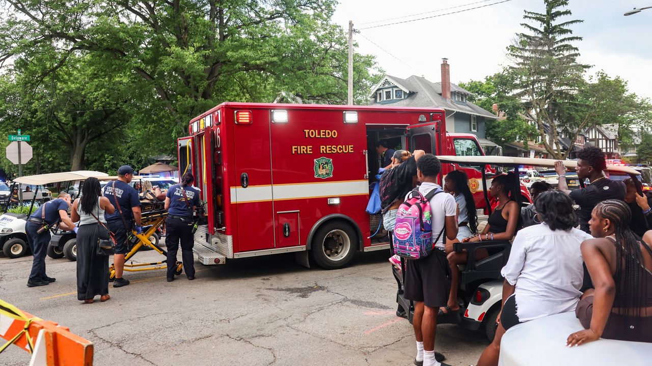 Toledo police investigate a shooting that left 12 people injured at the Old West End Festival at the Agnes Reynolds Jackson Arboretum in Toledo, Ohio, on Saturday, June 6, 2026. (Rebecca Benson/The Blade via AP)