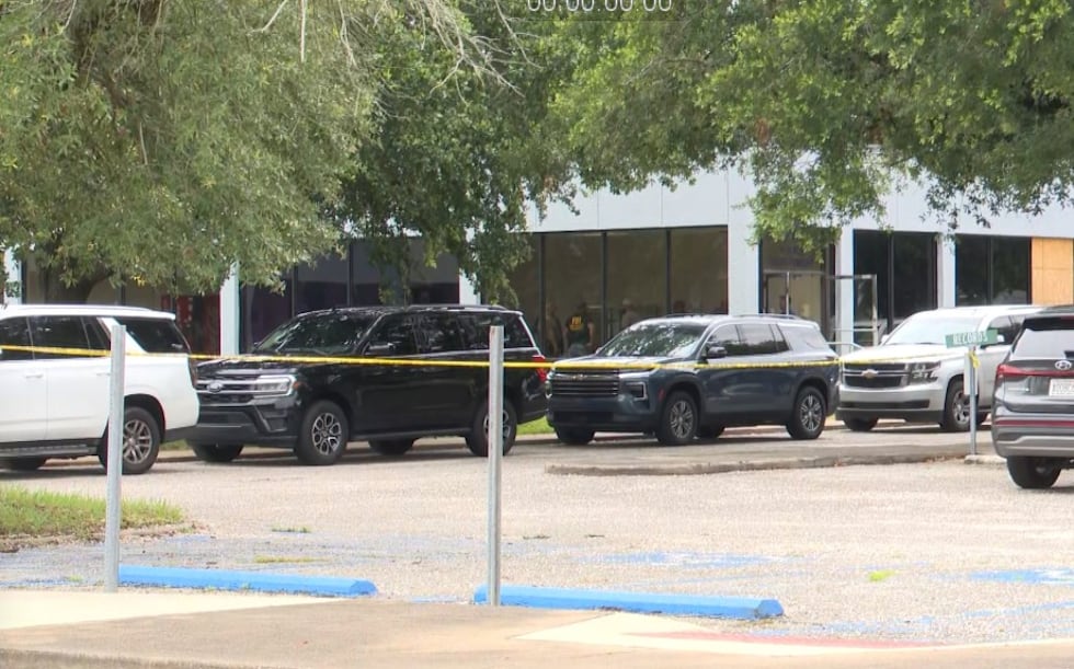 Crime scene tape is seen at the Prichard Municipal Complex.