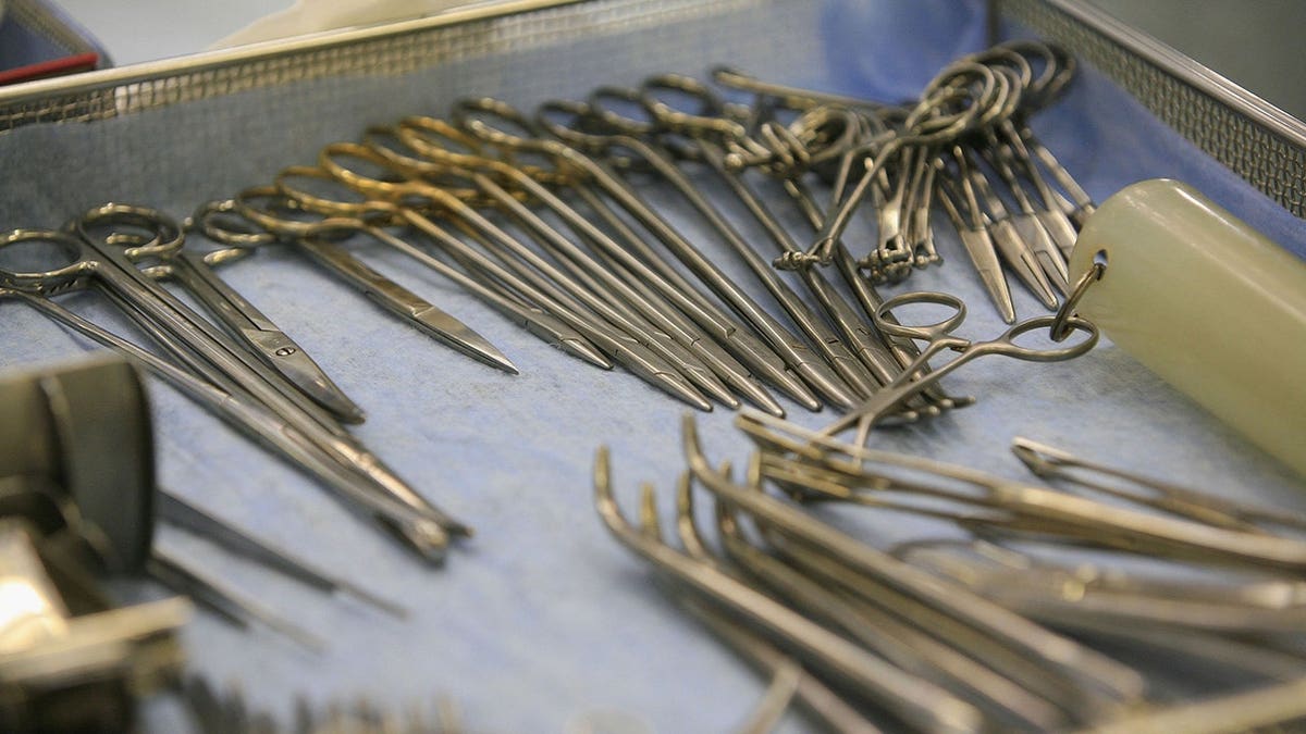 A tray of surgical instruments arranged for use during a medical procedure.