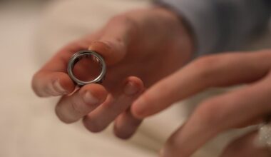 Middle school teacher Kate Stoye puts on an Oura ring, a wearable sleep tracking device in Hiram, Ga.
